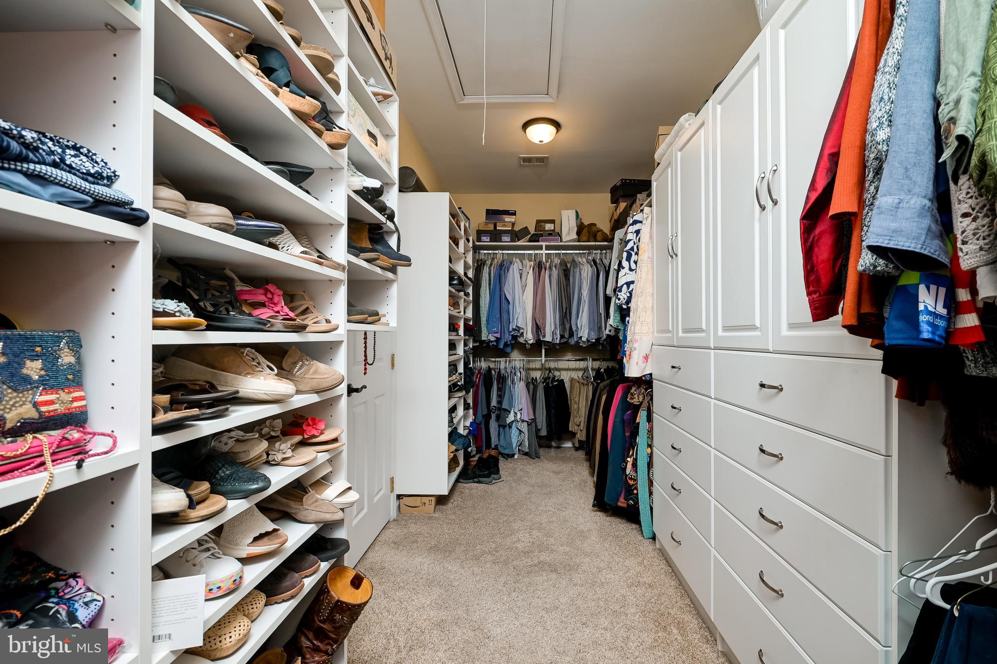 12850 Highland Road Highland, MD 20777 - Photo 35 of 56 a view of walk in closet with clothes and shoes