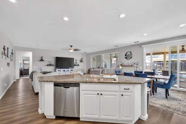 a view of a kitchen counter space and living room
