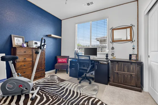 a bedroom with furniture and a closet
