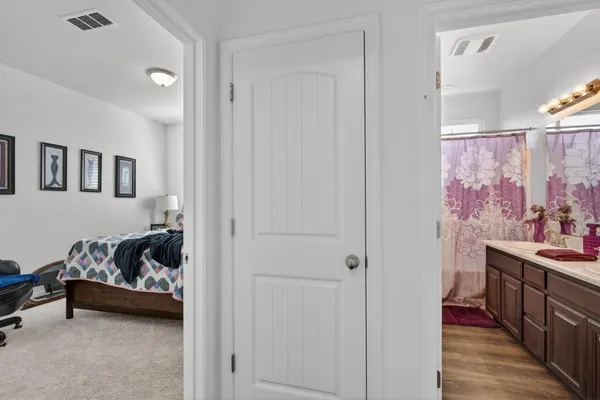 a bedroom with furniture and a window