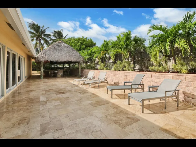 a view of a terrace with furniture and a potted plant