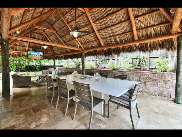a patio with a table and chairs