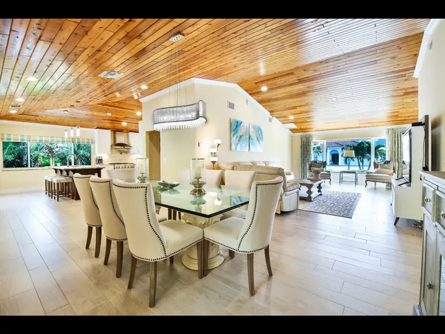 a dining room with furniture and wooden floor