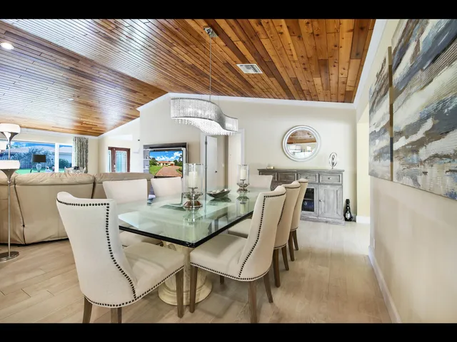 a view of a dining room with furniture and window
