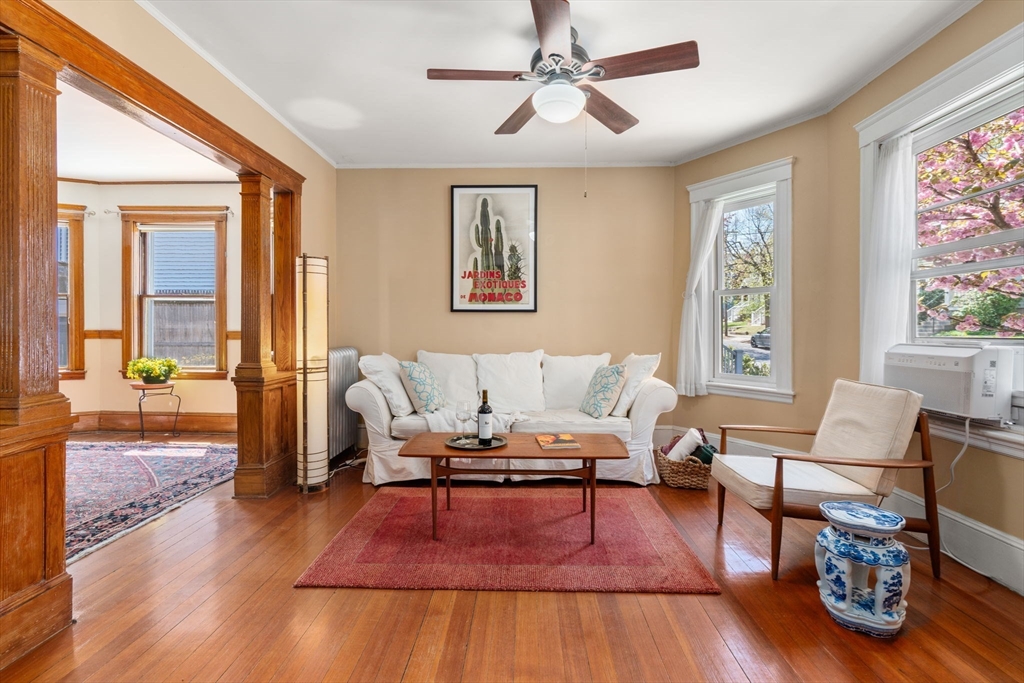 45 Springfield Street, Unit 1 Belmont, MA 02478 - Photo 4 of 27 a living room with furniture and a wooden floor