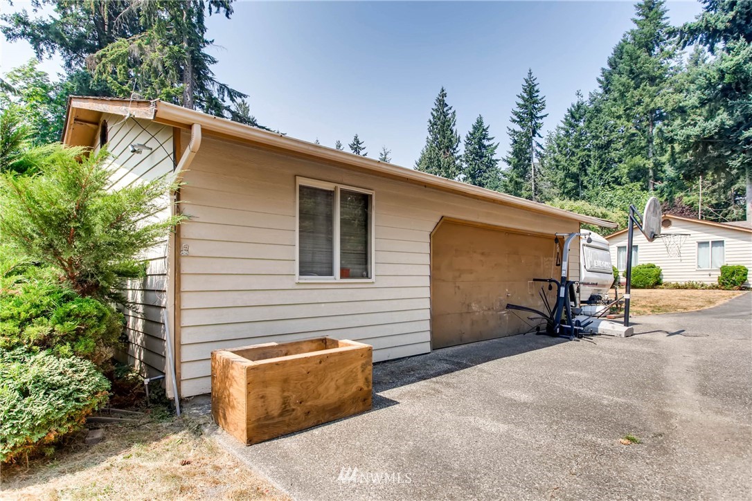 109 West Winesap Road Bothell, WA 98012 - Photo 22 of 22 a view of a house with a patio