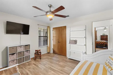 a view of a livingroom with furniture and a flat screen tv