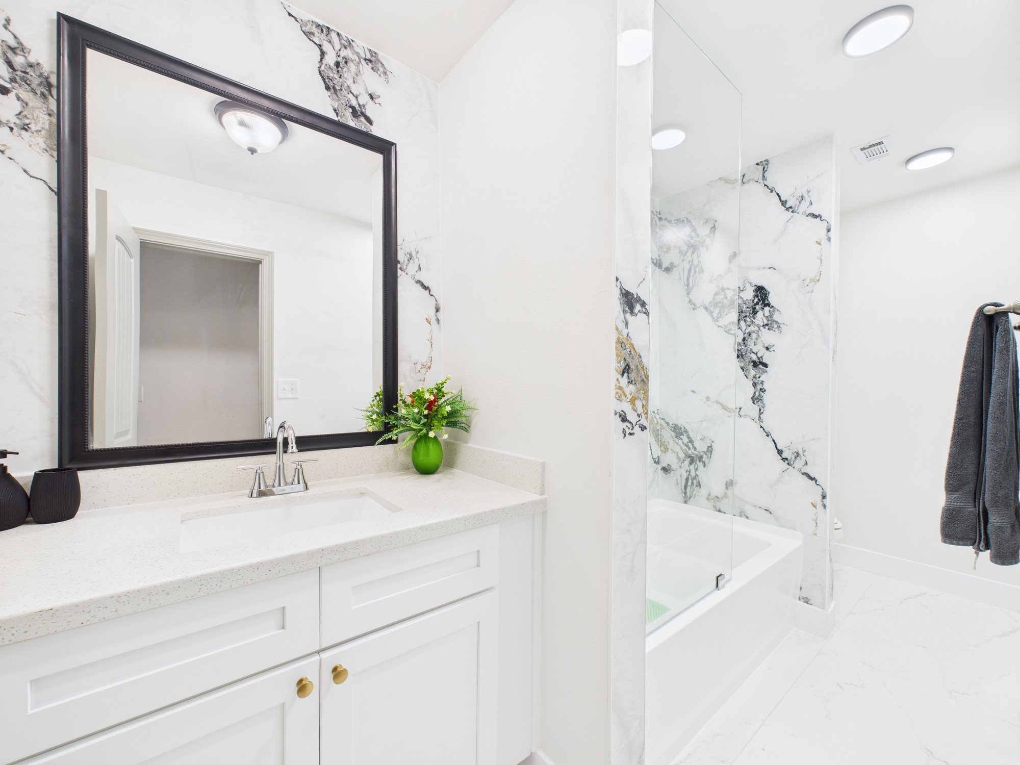 7836 Bateman Lane, Unit 7836 Houston, TX 77088 - Photo 24 of 44 Fabulously Updated Primary Bath with Marble Treatment