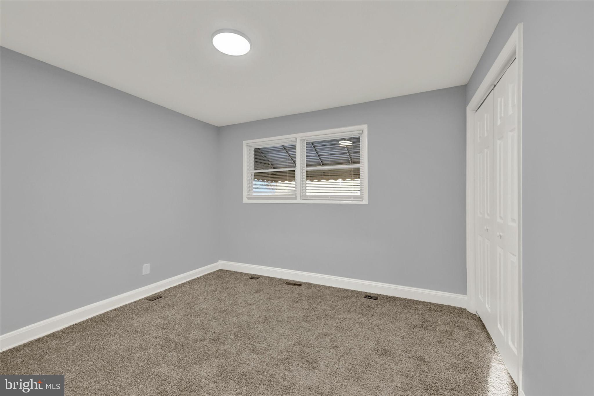 3105 Frisby Street Baltimore, MD 21218 - Photo 12 of 22 an empty room with a empty space and a window
