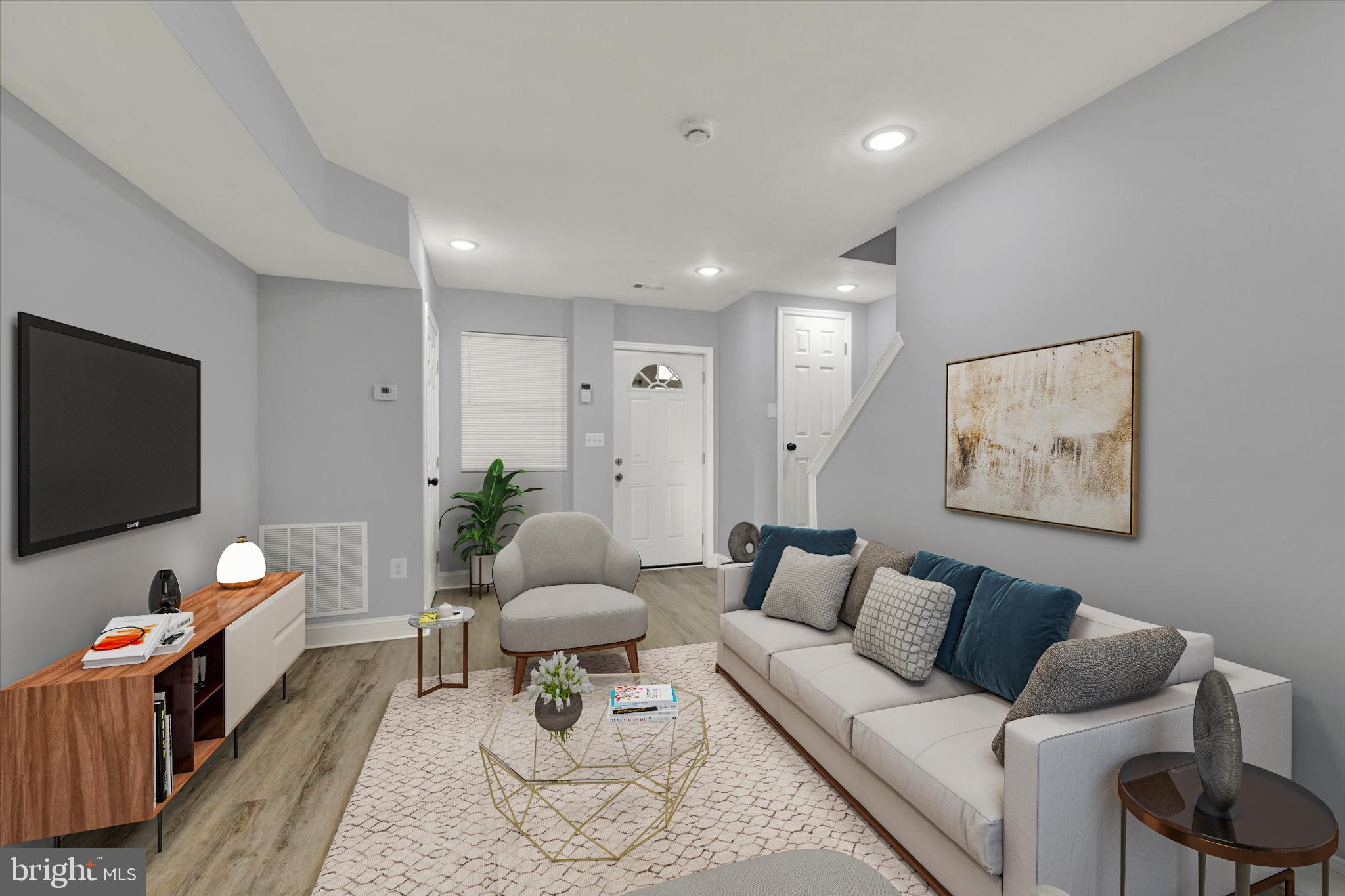 3105 Frisby Street Baltimore, MD 21218 - Photo 4 of 22 a living room with furniture and a flat screen tv