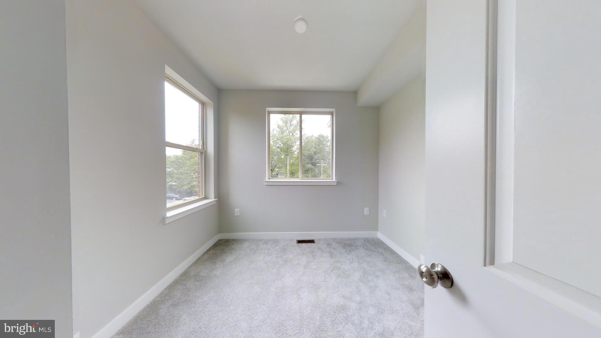 1262 Talbert Street Southeast, Unit A Washington, DC 20020 - Photo 15 of 20 an empty room with windows