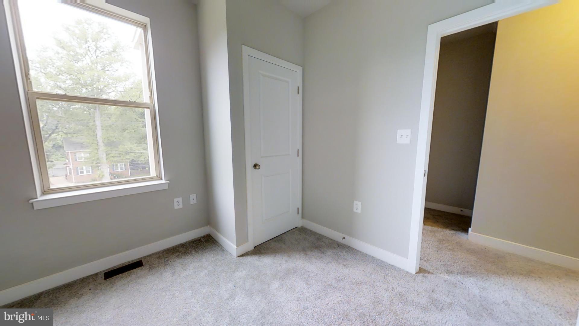 1262 Talbert Street Southeast, Unit A Washington, DC 20020 - Photo 17 of 20 an empty room with windows