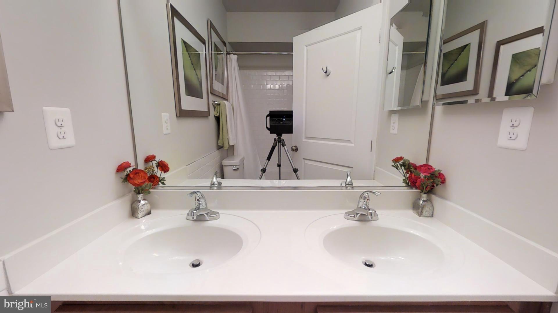 1262 Talbert Street Southeast, Unit A Washington, DC 20020 - Photo 9 of 20 a bathroom with a sink and a mirror