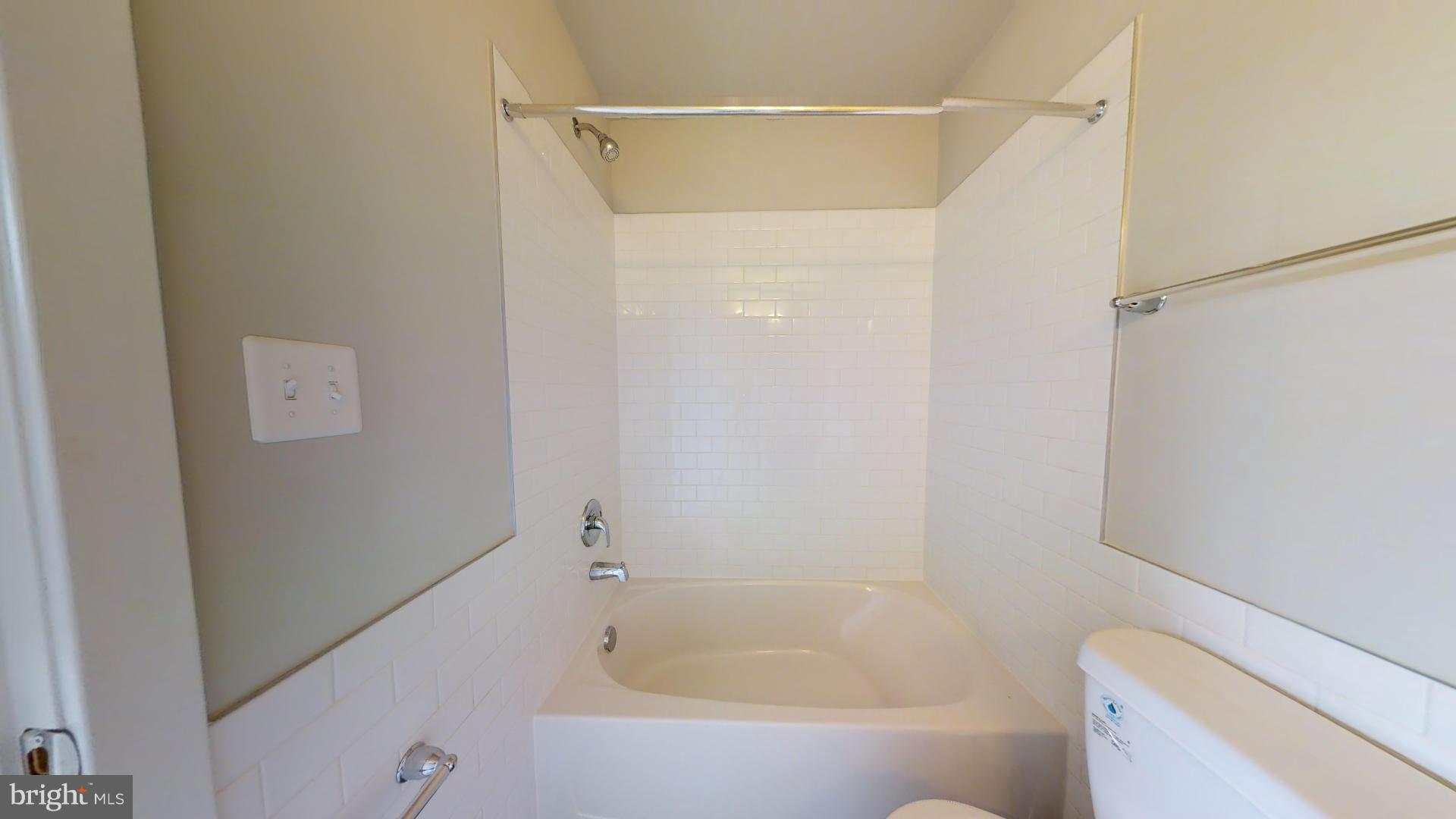 1262 Talbert Street Southeast, Unit A Washington, DC 20020 - Photo 10 of 20 a bathroom with a bathtub and a shower