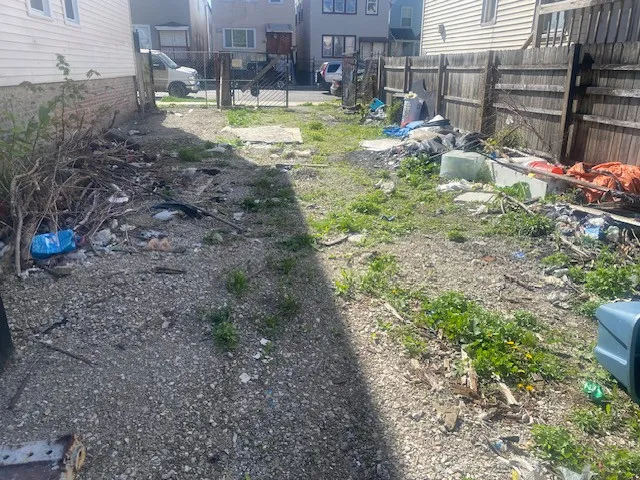 a view of swimming pool with a yard and sitting area
