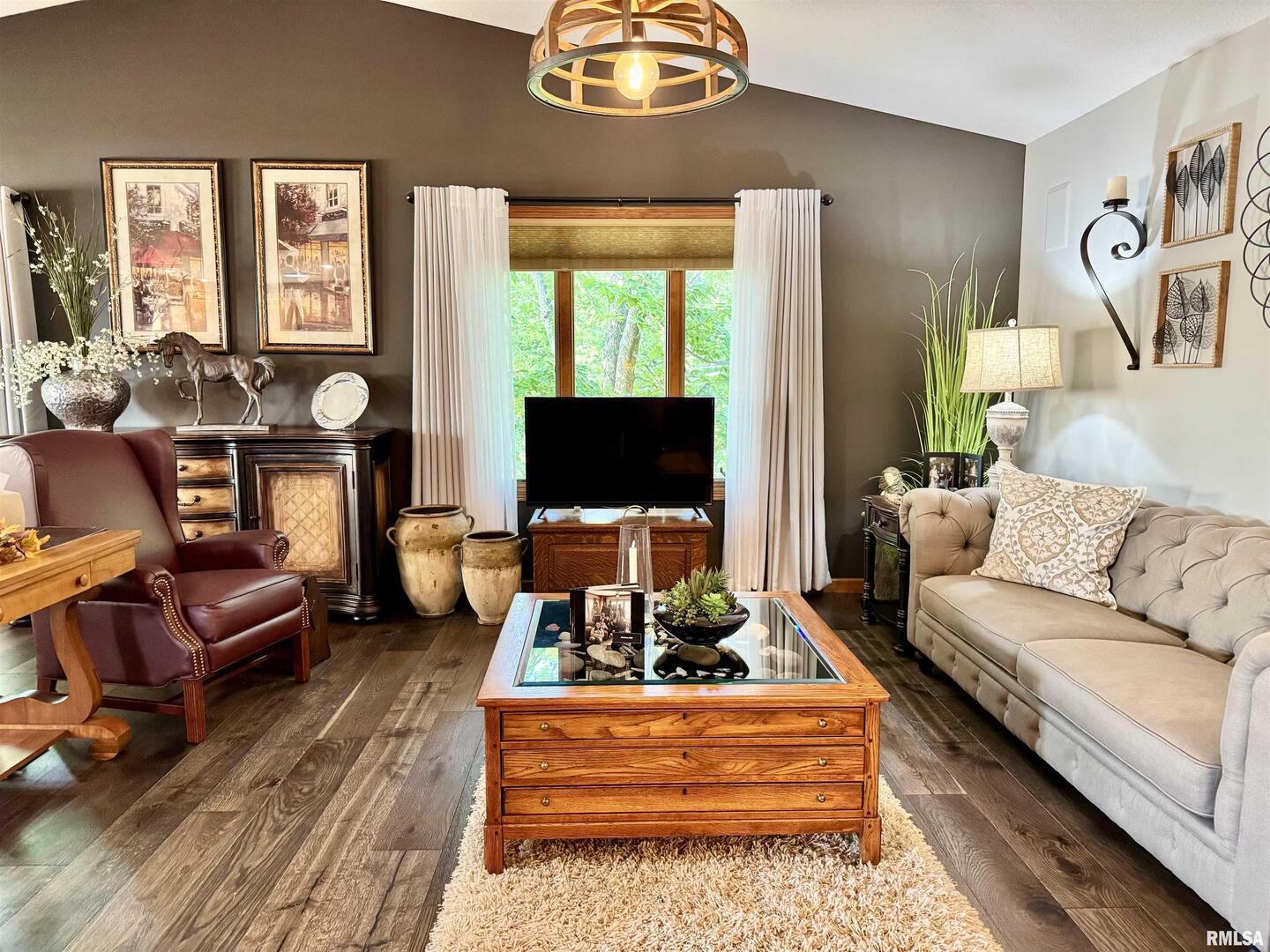 102 5th Street, Unit 6 Fulton, IL 61252 - Photo 14 of 42 a living room with furniture a flat screen tv and a floor to ceiling window