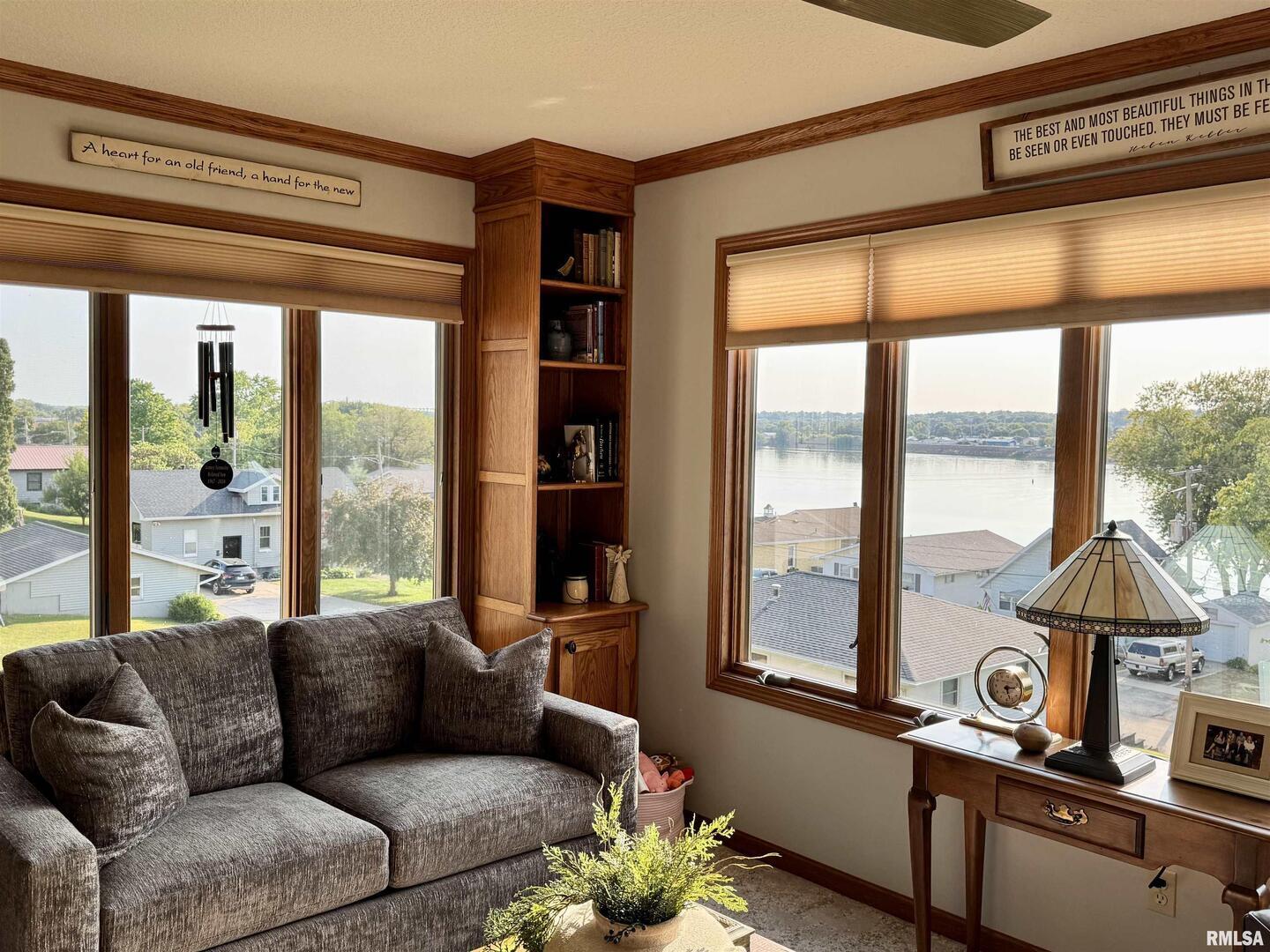 102 5th Street, Unit 6 Fulton, IL 61252 - Photo 21 of 42 a living room with furniture and a large window