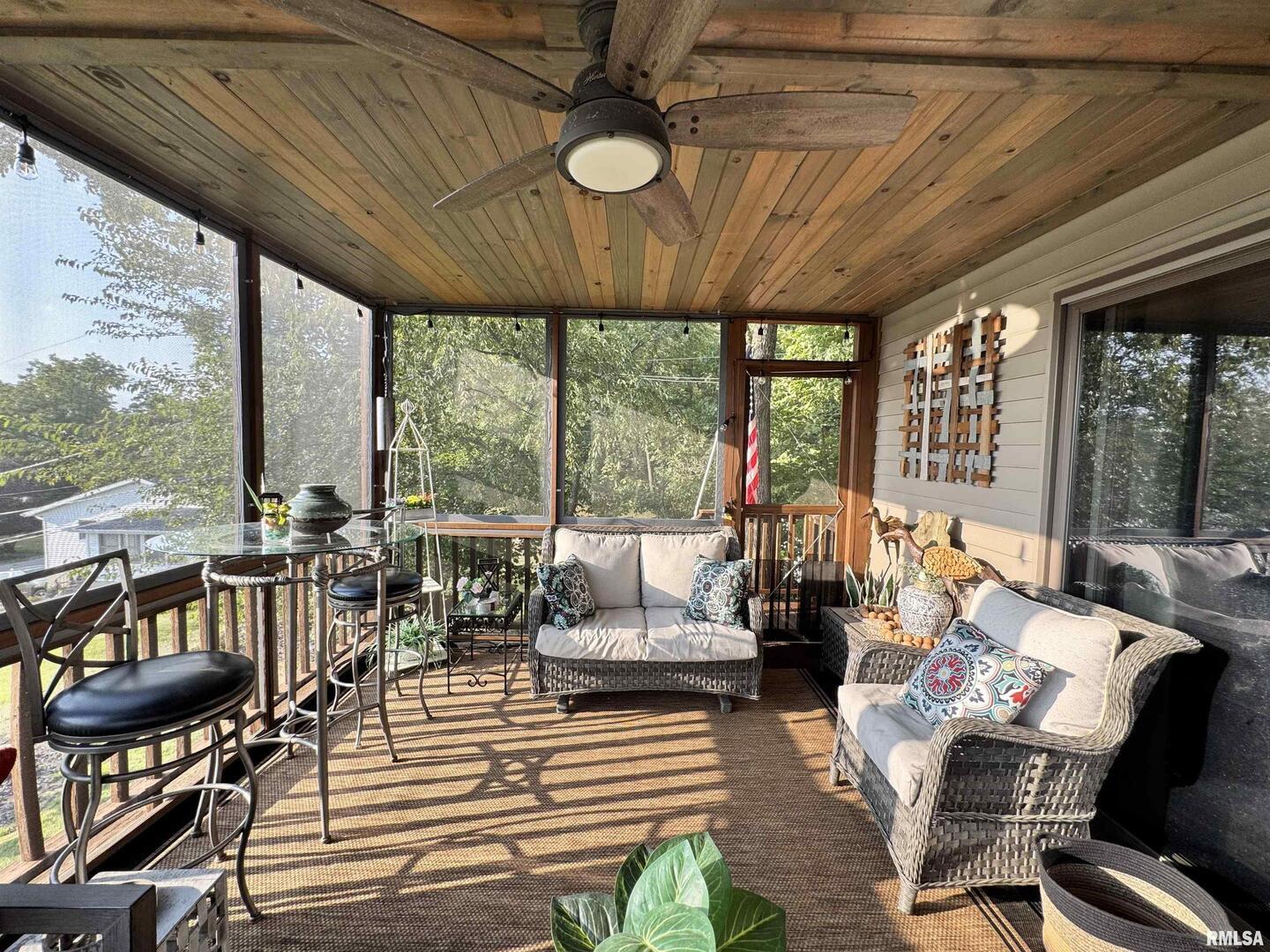 102 5th Street, Unit 6 Fulton, IL 61252 - Photo 42 of 42 a living room filled with furniture and a large window