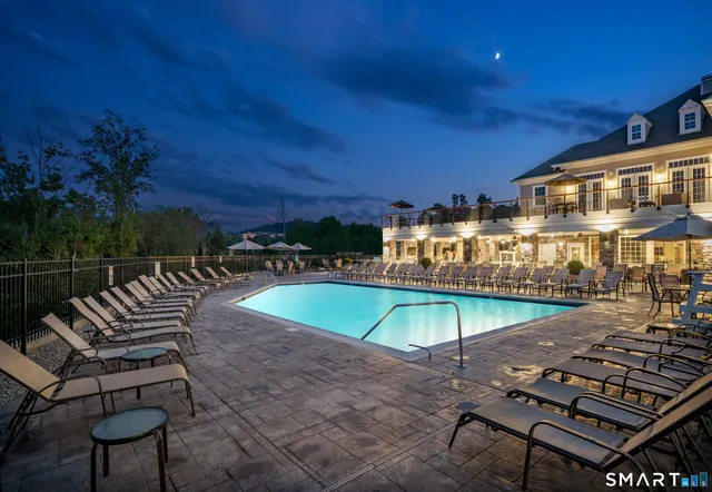 a view of a swimming pool with a lounge chairs