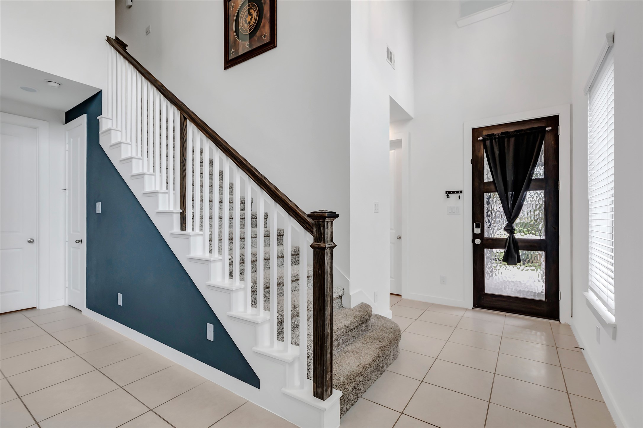 527 Chestnut Reef Court Conroe, TX 77304 - Photo 6 of 40 a view of a hallway with entryway and stairs