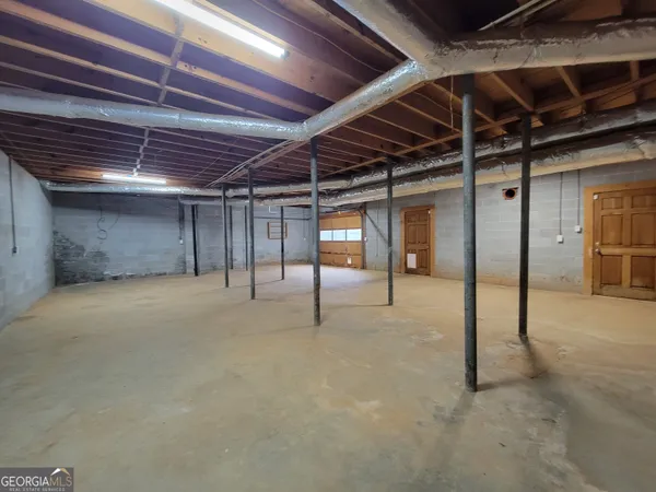 a view of an empty room with wooden roof
