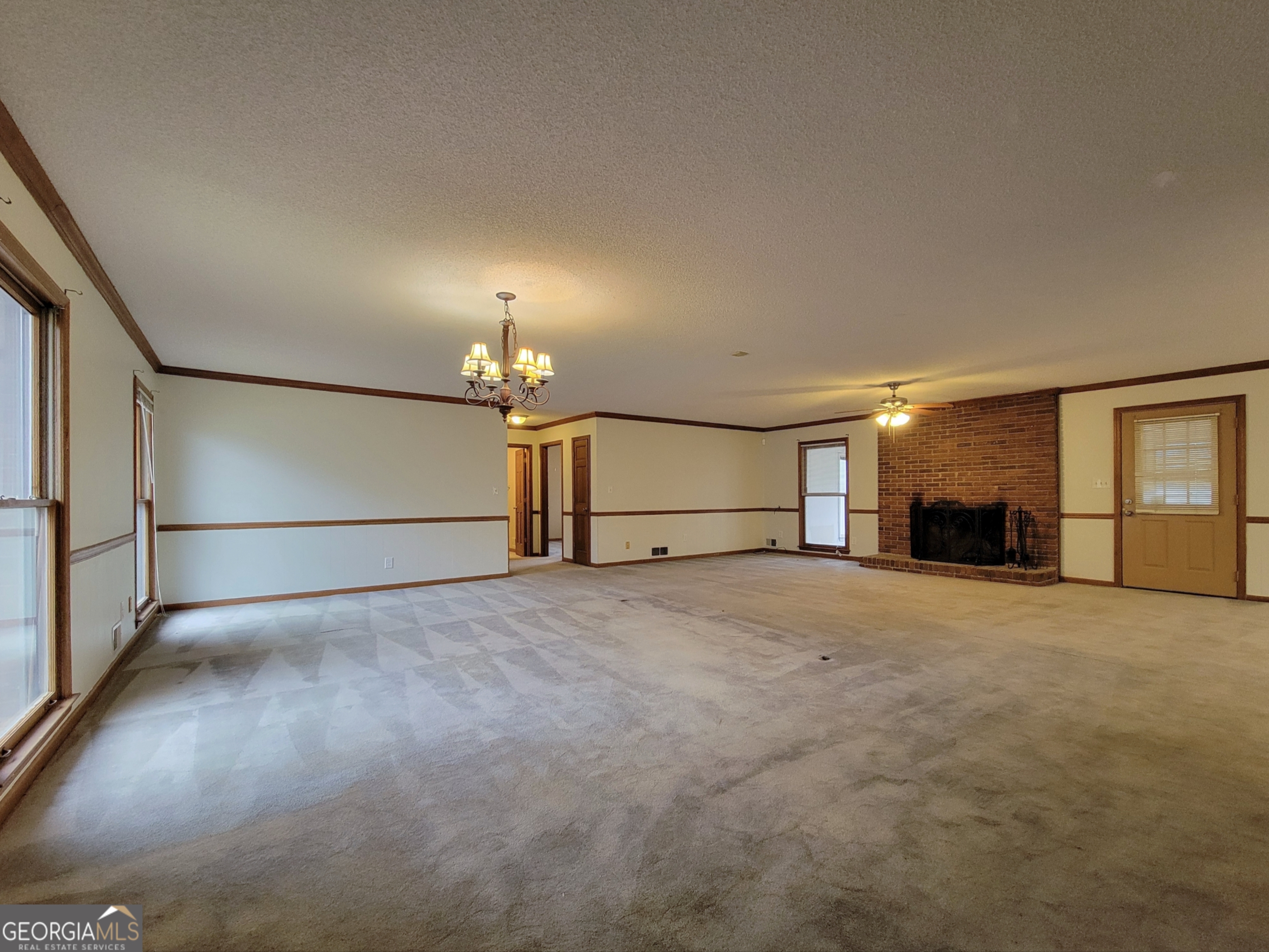 788 Harrison Mill Road Winder, GA 30680 - Photo 2 of 19 a view of empty room with a fireplace