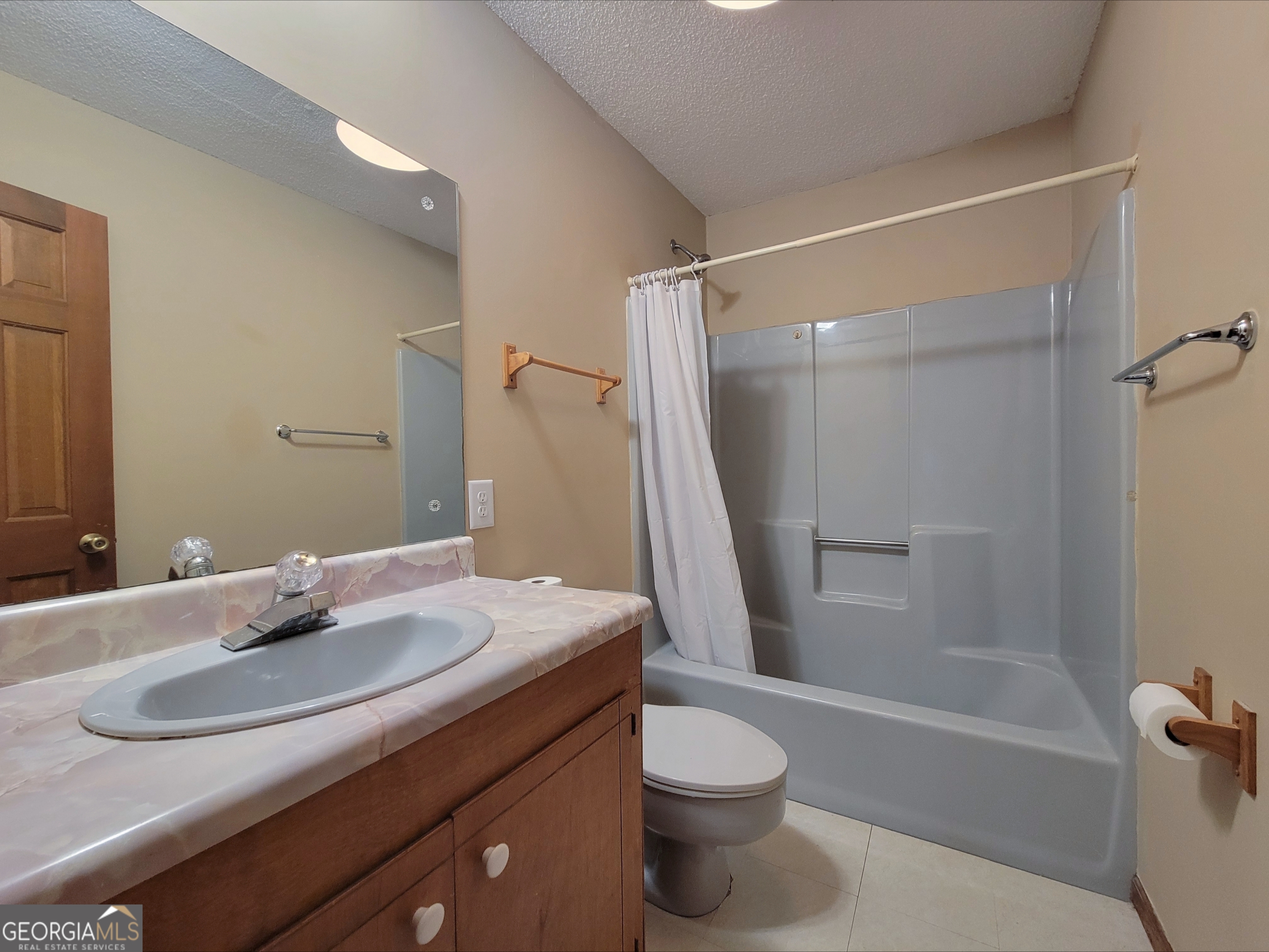 788 Harrison Mill Road Winder, GA 30680 - Photo 10 of 19 a bathroom with a sink toilet and shower
