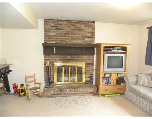 5681 Aiken Road McKees Rocks, PA 15136 - Photo 8 of 17 Family Room. Log-burning fireplace, raised brick hearth