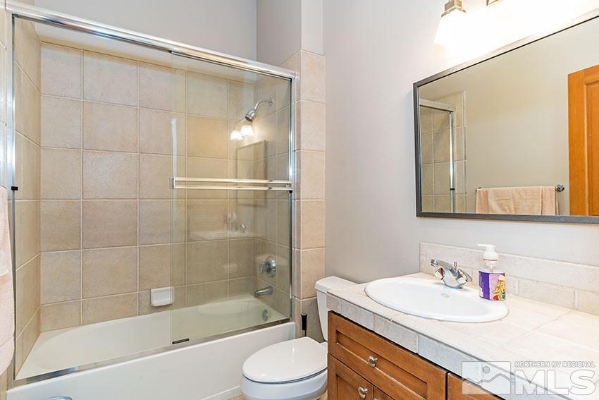 4971 Fall Creek Court Reno, NV 89519 - Photo 16 of 21 a bathroom with a sink a toilet and shower