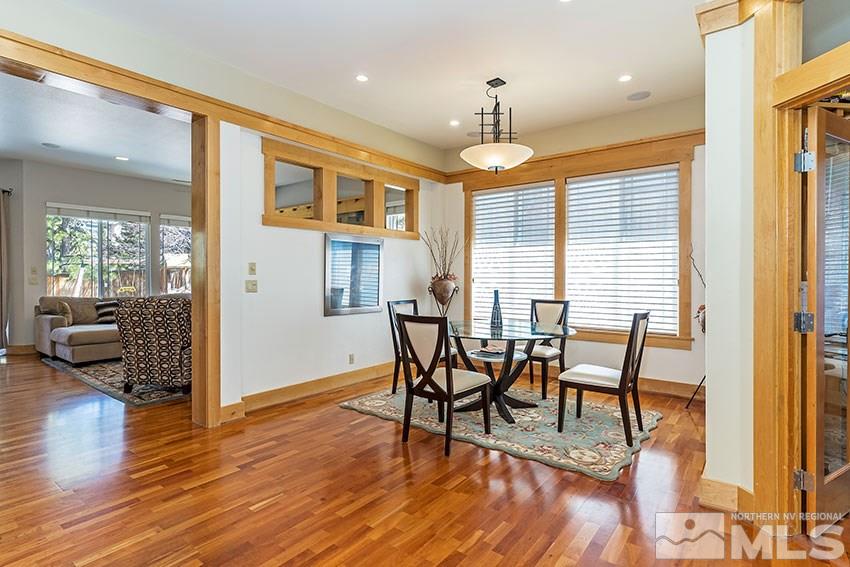 4971 Fall Creek Court Reno, NV 89519 - Photo 3 of 21 a view of a dining room with furniture window and wooden floor