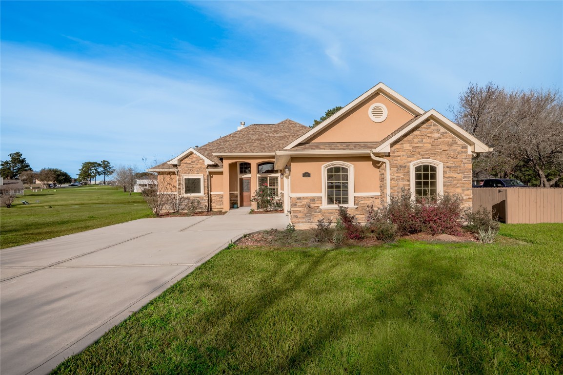 a front view of a house with a garden