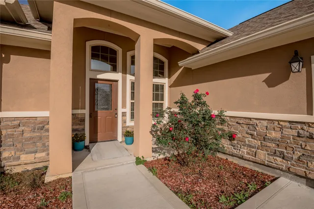 a view of a entryway door front of house