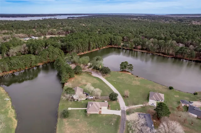 an aerial view of a house with a lake view