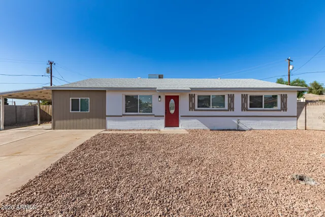 a front view of a house with yard
