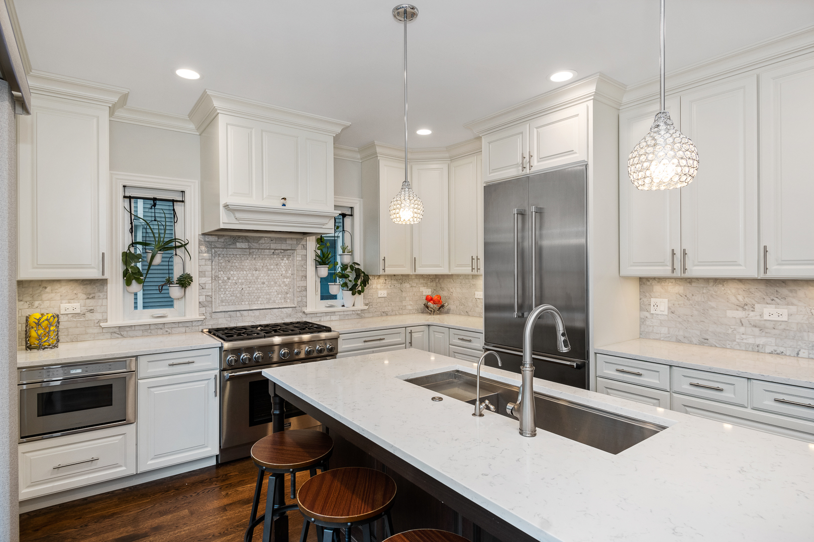 129 Woodside Road Riverside, IL 60546 - Photo 14 of 47 a kitchen with kitchen island a counter space a stove a refrigerator and cabinets