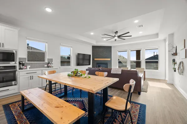 a view of a dining room with furniture window and wooden floor