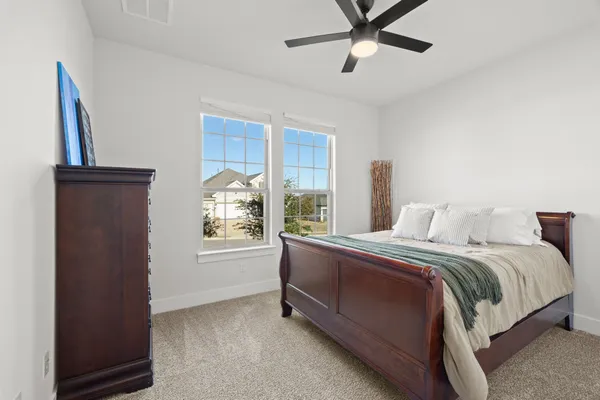 a bed room with a bed and a window