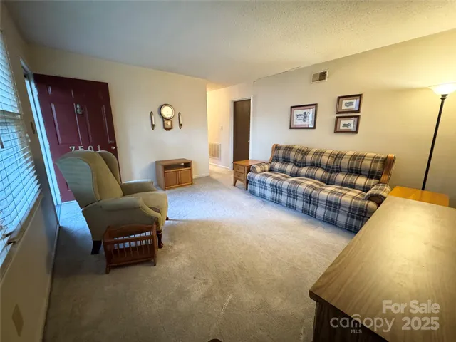 a living room with furniture and a couch