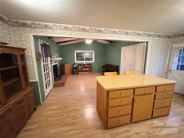 a spacious bathroom with a sink a mirror and a bathtub