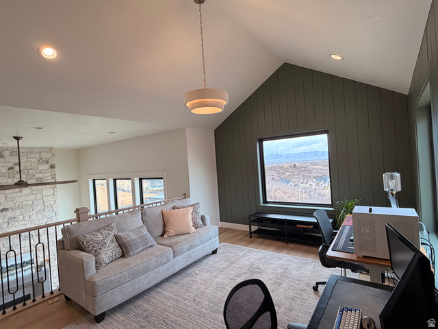 3626 Riverstone Road Mapleton, UT 84664 - Photo 22 of 58 Living room with light wood-style flooring, a desk, wooden walls, plenty of natural light, and recessed lighting