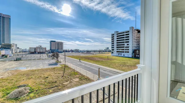 a view of a swimming pool with a lounge chair