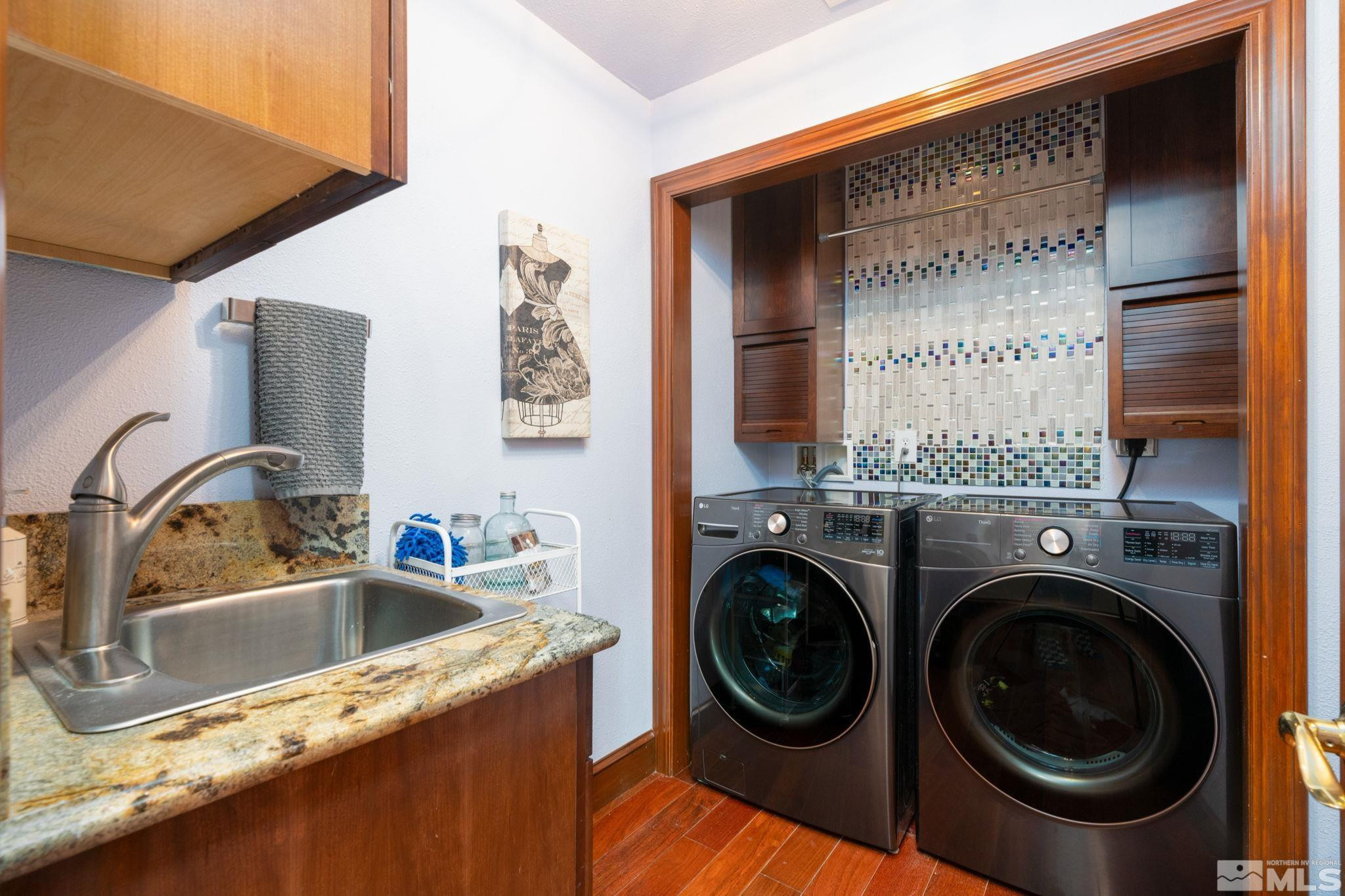 15350 Yankee Blade Road Reno, NV 89521 - Photo 16 of 27 a bathroom with a sink a washer and dryer