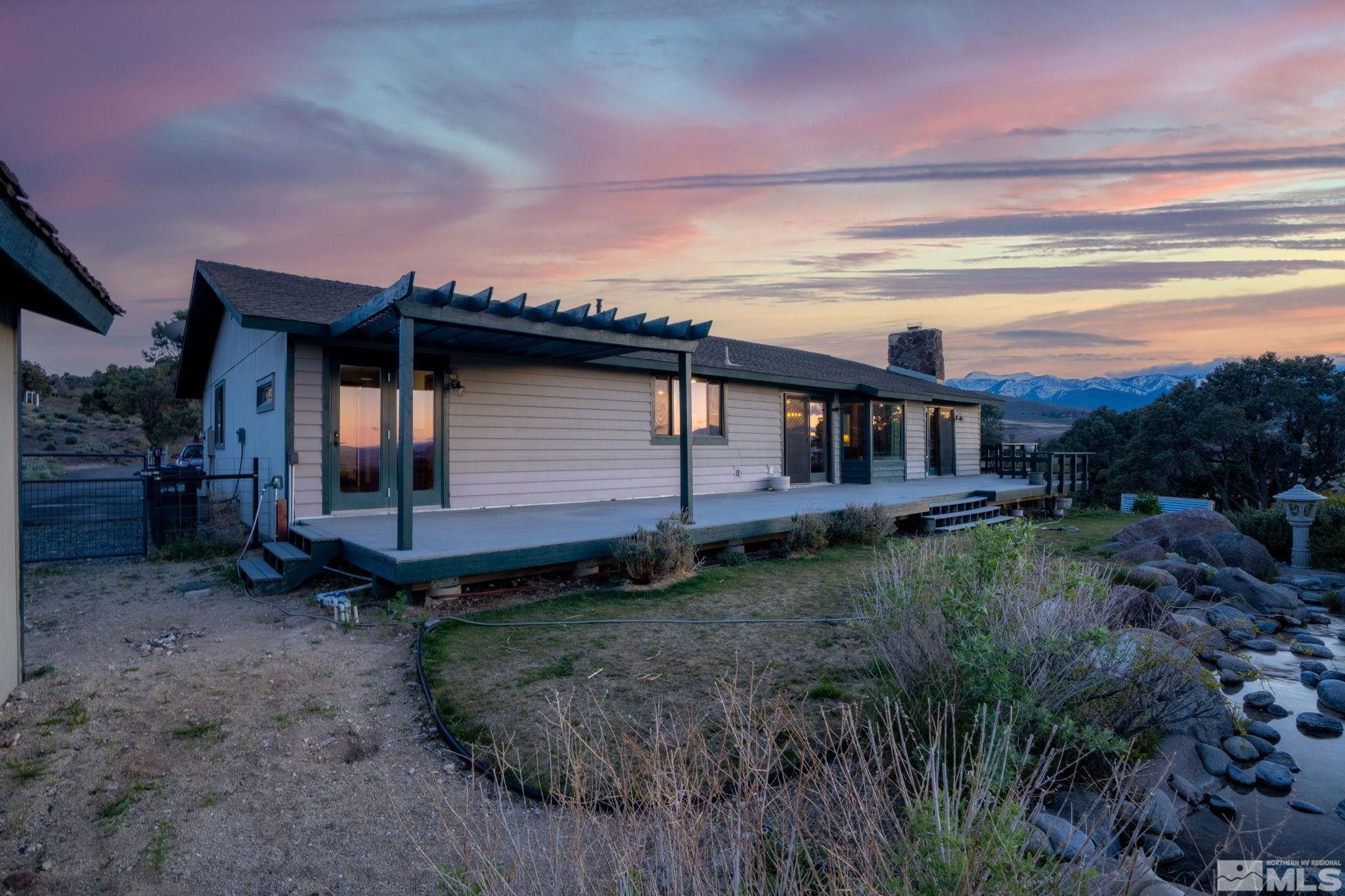 15350 Yankee Blade Road Reno, NV 89521 - Photo 21 of 27 a backyard of a house with lots of green space