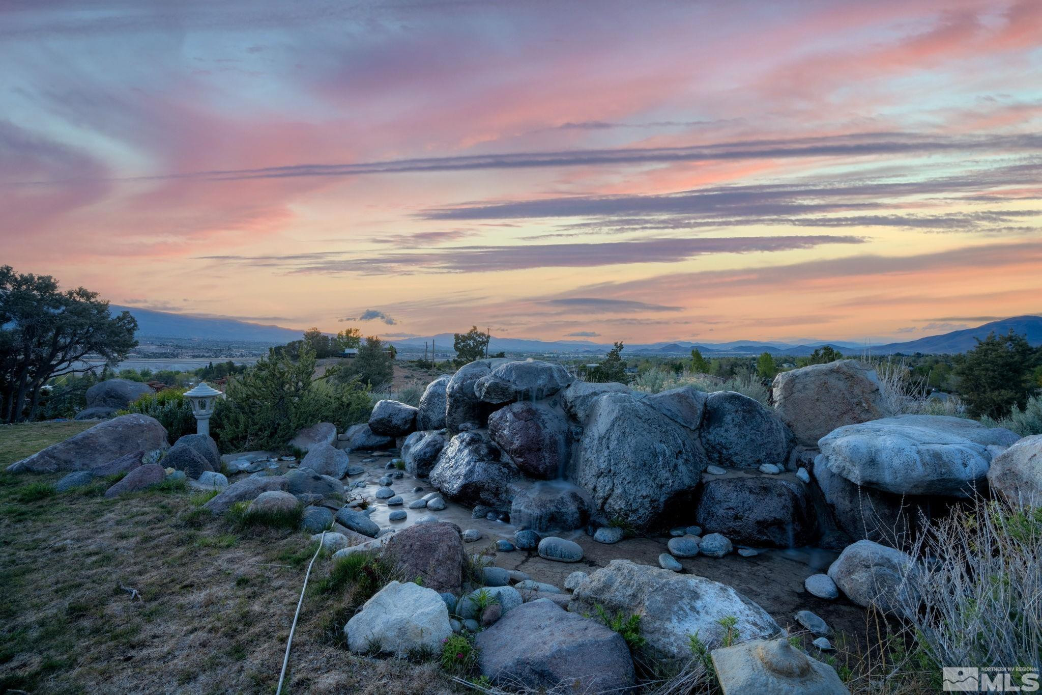 15350 Yankee Blade Road Reno, NV 89521 - Photo 23 of 27 a view of a city with lots of space and a car parked in the background