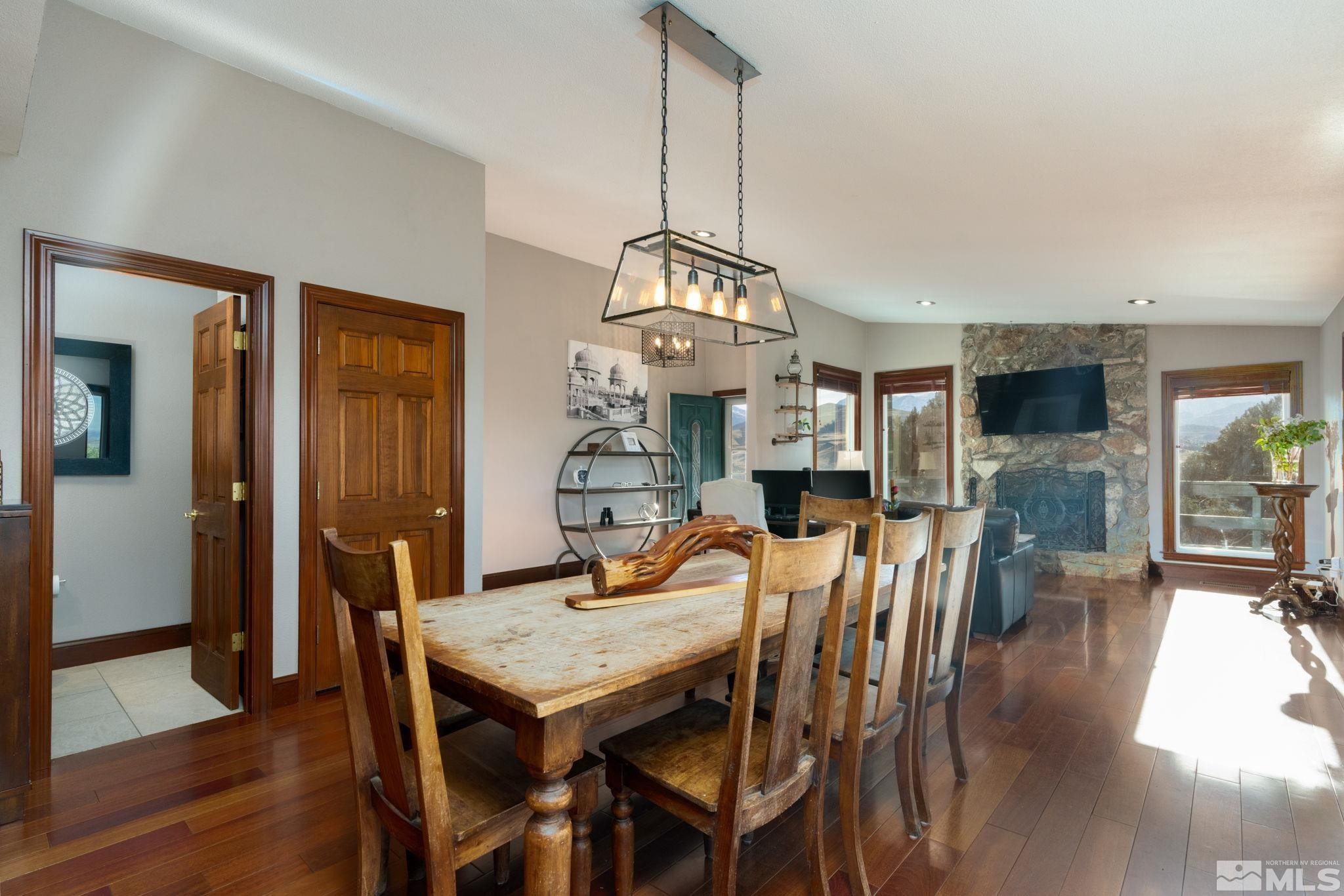 15350 Yankee Blade Road Reno, NV 89521 - Photo 4 of 27 a view of a dining room with furniture window and wooden floor