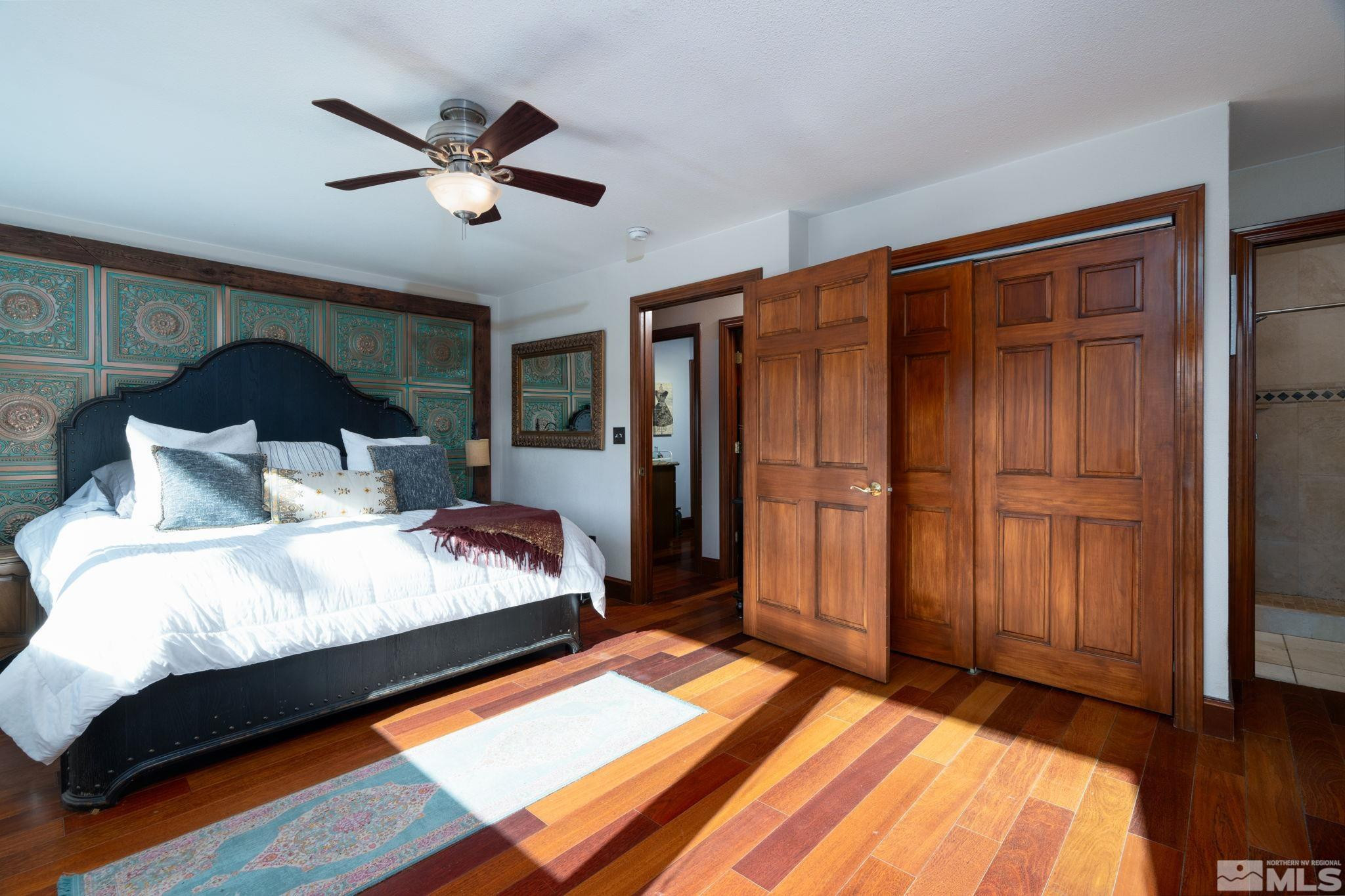 15350 Yankee Blade Road Reno, NV 89521 - Photo 10 of 27 a bedroom with bed and wooden floor