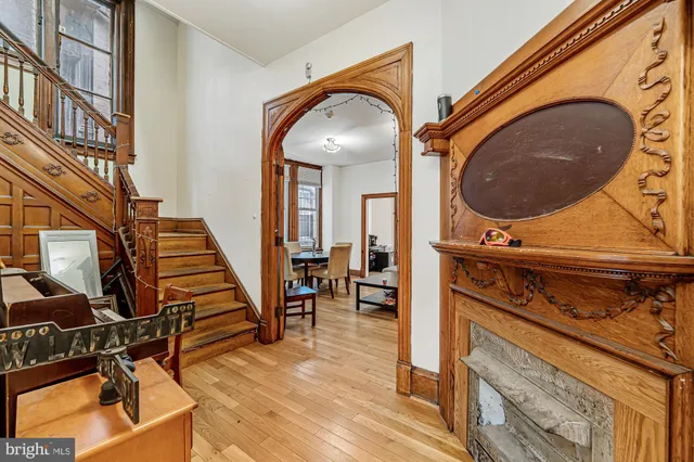 a view of a livingroom with furniture and staircase