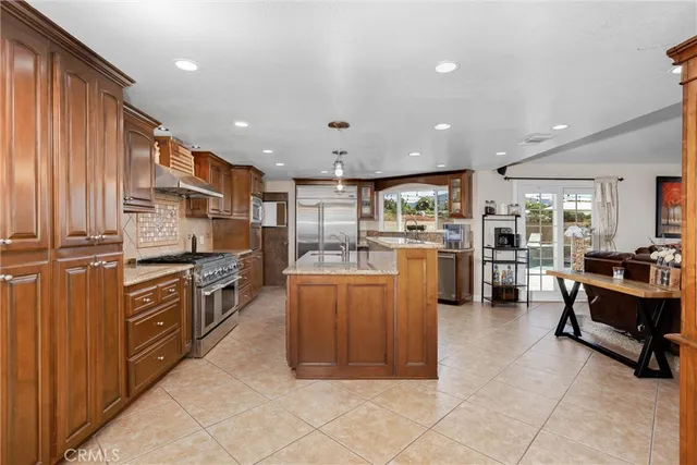 a view of kitchen with stainless steel appliances granite countertop cabinets and outdoor counter space