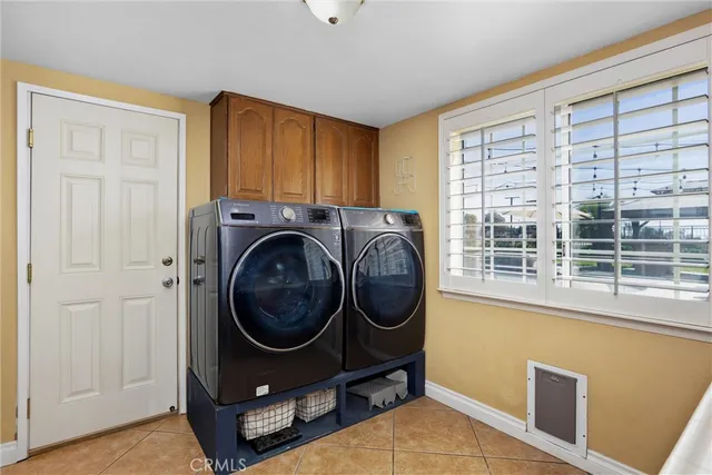 a bedroom with a bed and a television