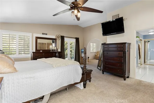 a livingroom with workspace fireplace and a window